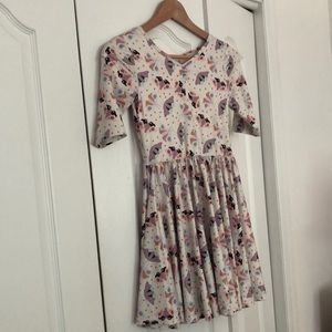 Lovely Dot Dot Smile dress with 3/4 sleeves and swirling skirt. Pastel colors.